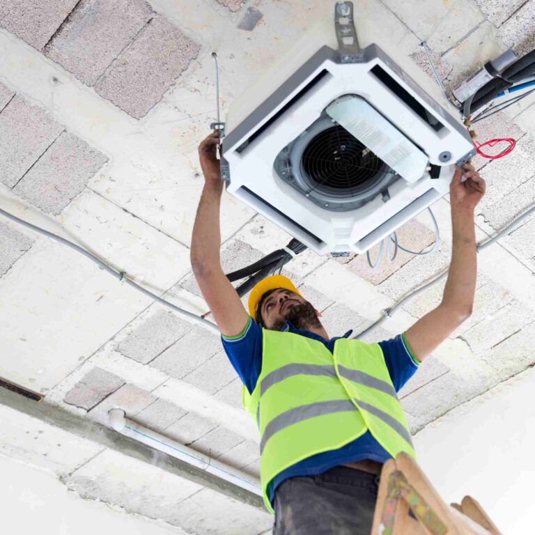 a man with safety helmet repairing HVAC system